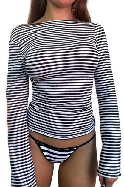 Person wearing a black and white striped long-sleeve top and matching underwear on a white background