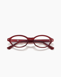 Red eyeglasses on a white background