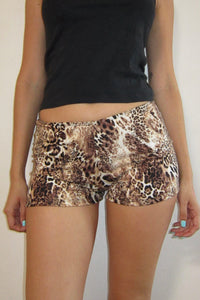 The image displays a pair of stylish "Zoe shorts" featuring a trendy leopard print pattern. These shorts are crafted from a comfortable and soft fabric, offering a blend of stretch and non-sheer material that ensures both comfort and durability.